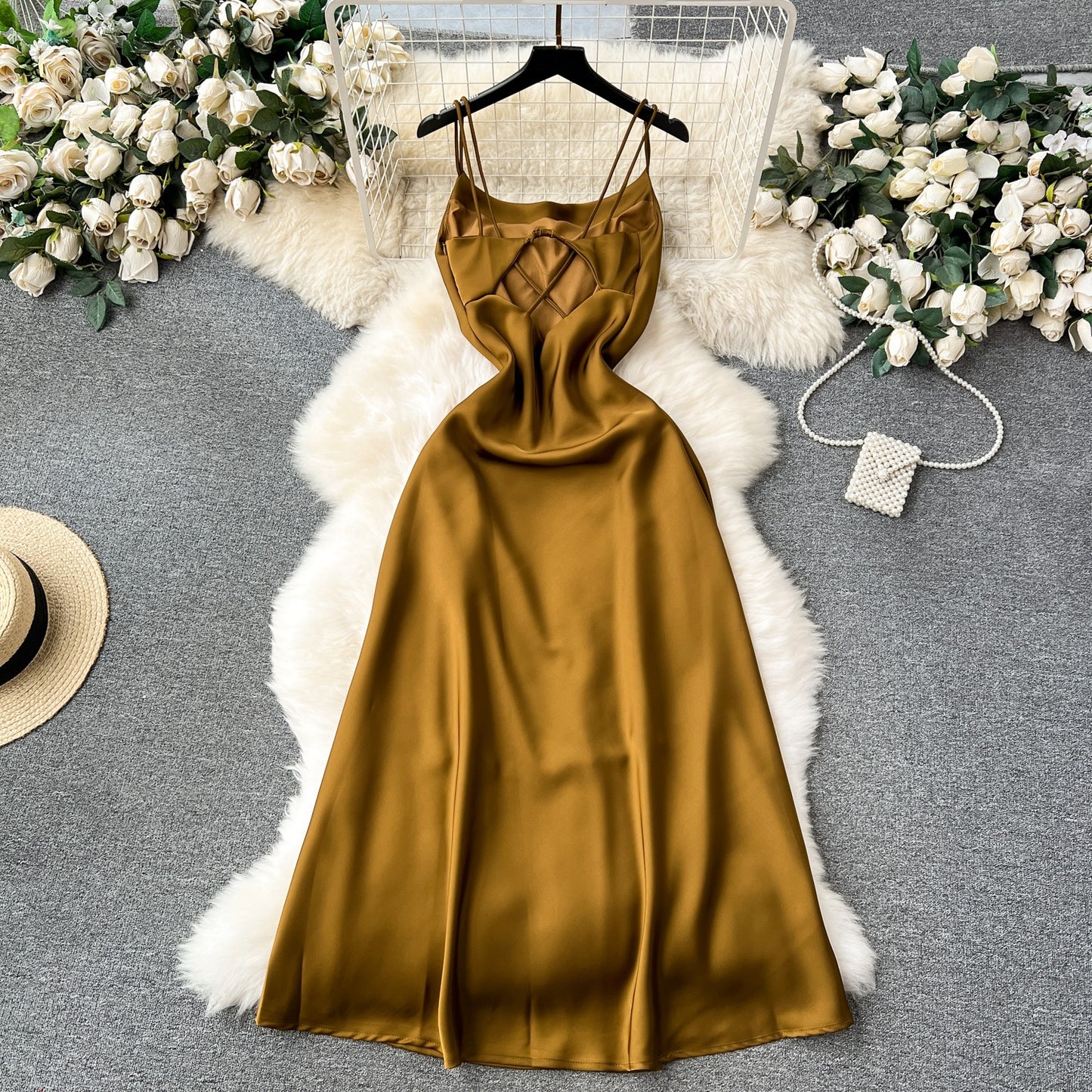 A camisole dress for women with a French style and elegant style. A slim fit satin formal dress with a swinging collar