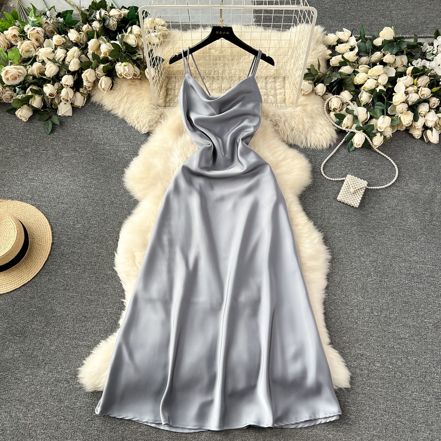 A camisole dress for women with a French style and elegant style. A slim fit satin formal dress with a swinging collar