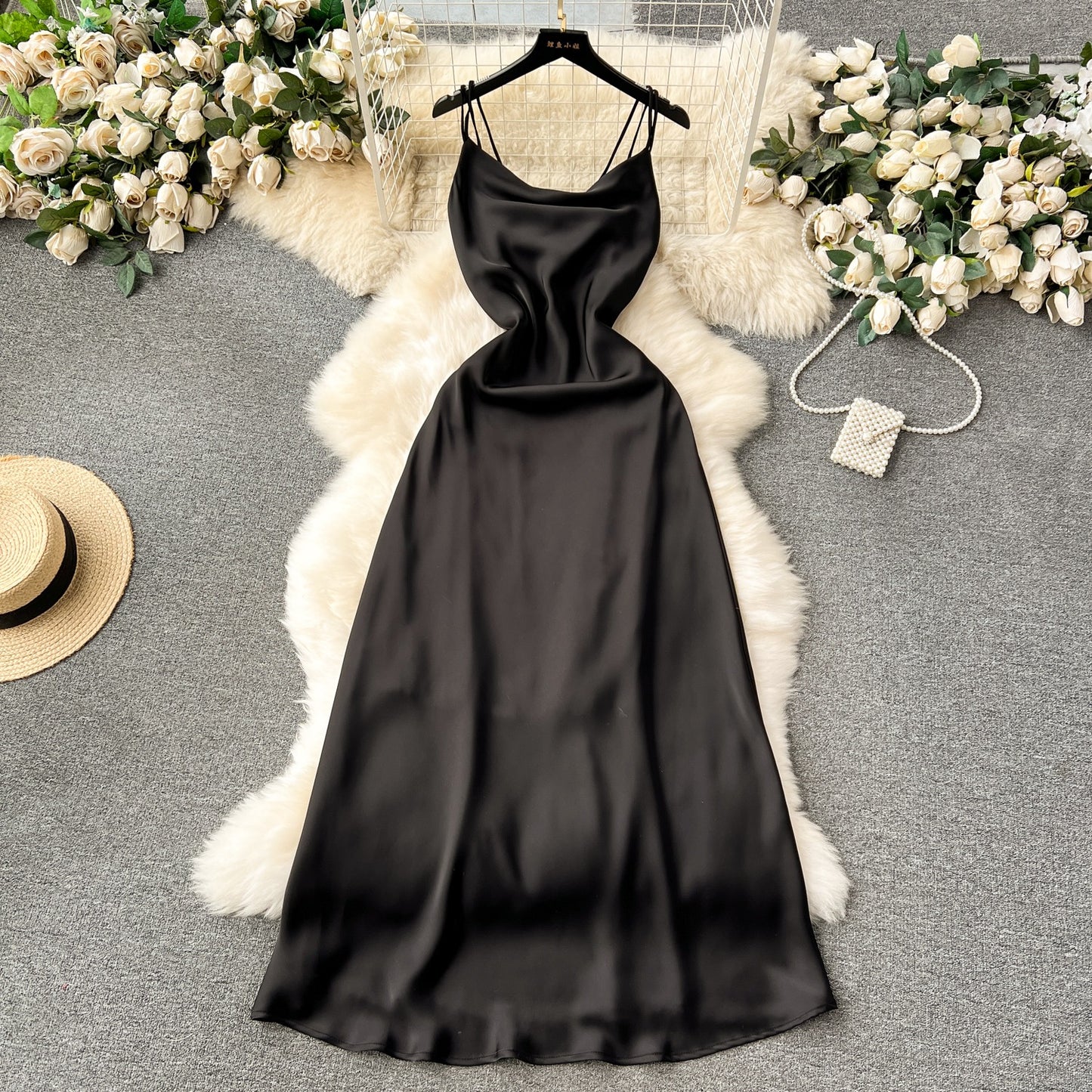A camisole dress for women with a French style and elegant style. A slim fit satin formal dress with a swinging collar