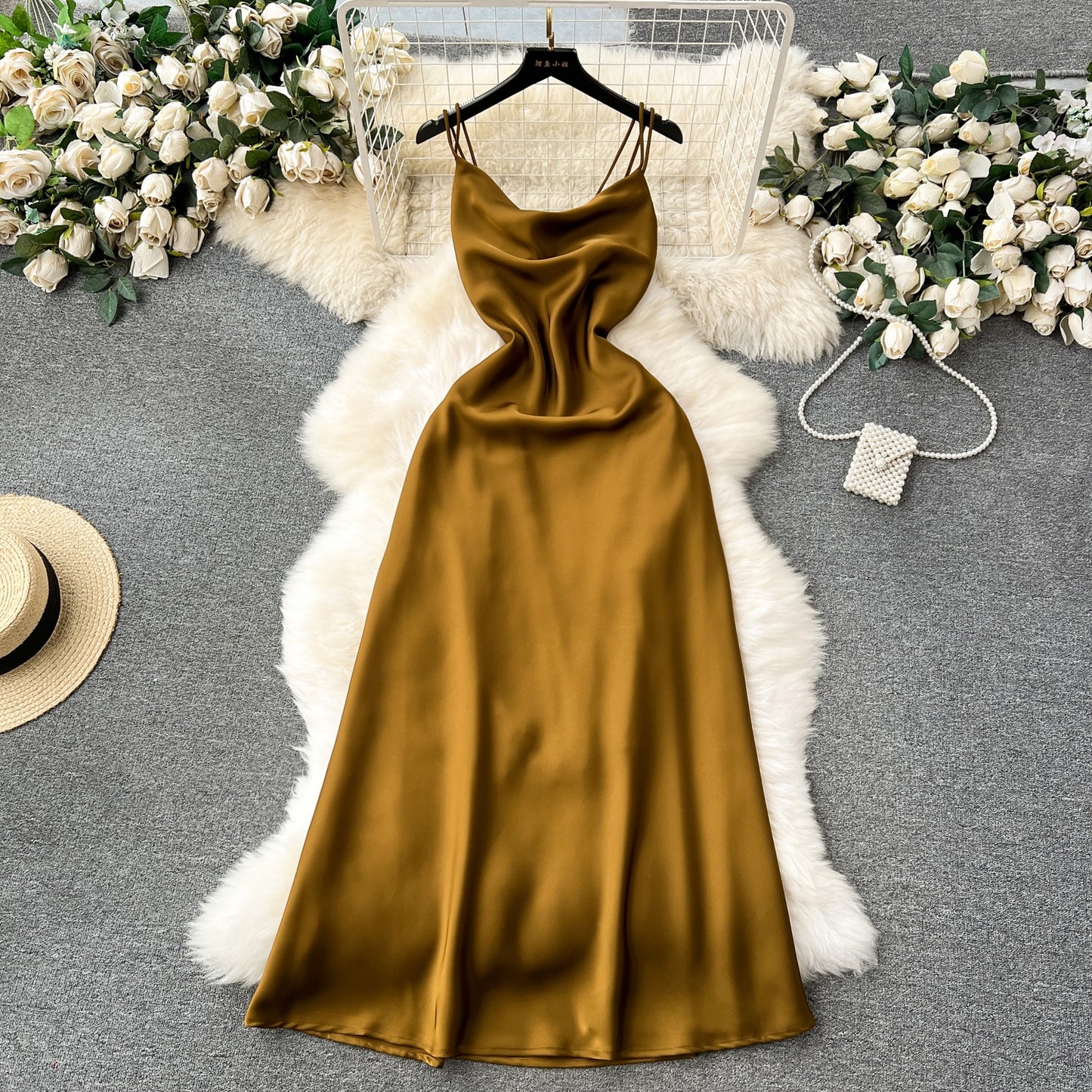 A camisole dress for women with a French style and elegant style. A slim fit satin formal dress with a swinging collar