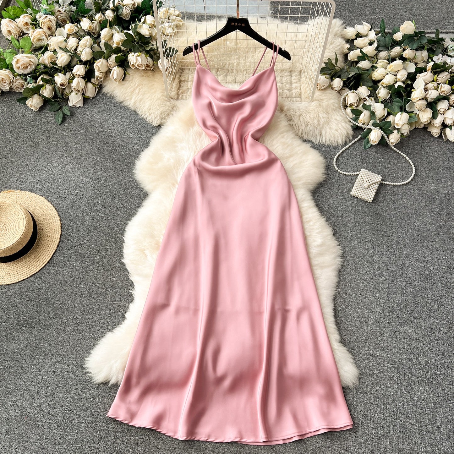 A camisole dress for women with a French style and elegant style. A slim fit satin formal dress with a swinging collar