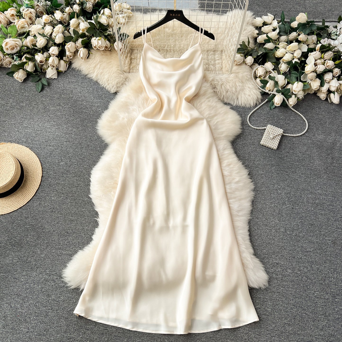A camisole dress for women with a French style and elegant style. A slim fit satin formal dress with a swinging collar